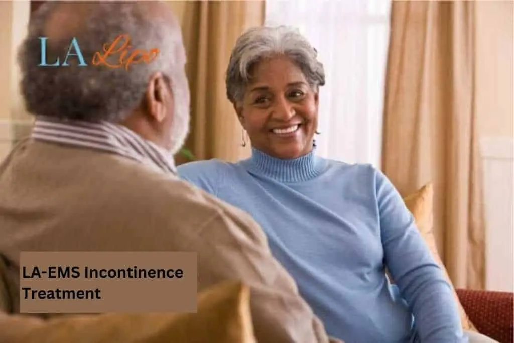Couple sat smiling at each other - LA-EMS treatment Winchmore Hill